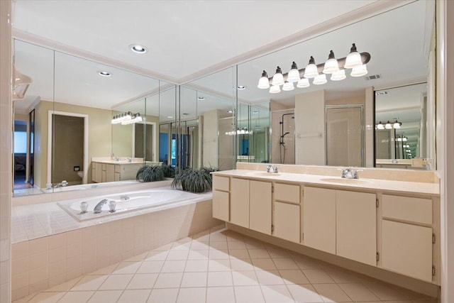 2646 Mohawk Cir, West Palm Beach, FL 33409 - full bath featuring double vanity, a stall shower, a garden tub, and tile patterned floors