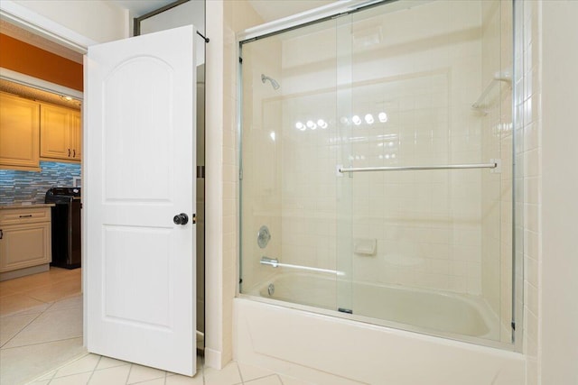 2646 Mohawk Cir, West Palm Beach, FL 33409 - full bathroom with tile patterned floors, enclosed tub / shower combo, and backsplash