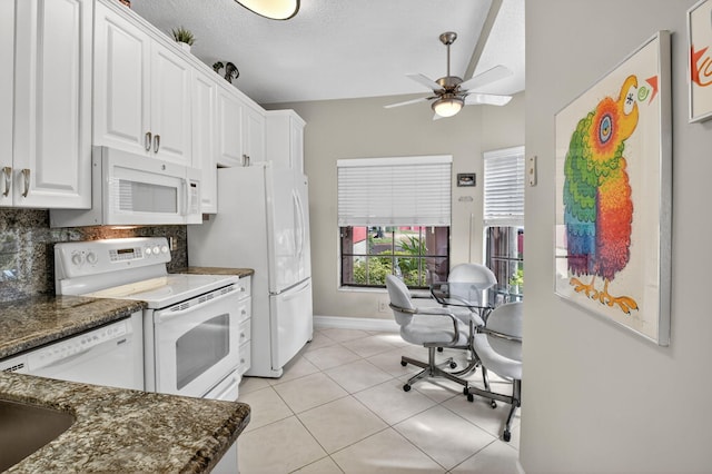 7824 Lexington Club Blvd Unit A, Delray Beach, FL 33446 - kitchen with white appliances, a ceiling fan, white cabinets, dark stone countertops, and lofted ceiling