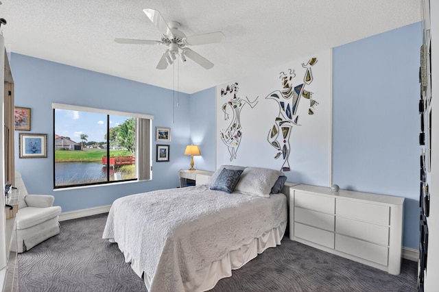 7824 Lexington Club Blvd Unit A, Delray Beach, FL 33446 - bedroom featuring dark colored carpet, a textured ceiling, and ceiling fan