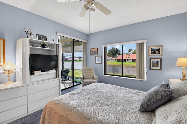 7824 Lexington Club Blvd Unit A, Delray Beach, FL 33446 - bedroom featuring access to exterior, a textured ceiling, and ceiling fan