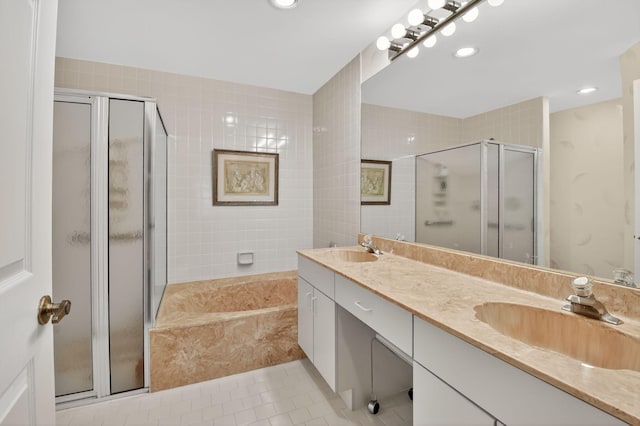 7824 Lexington Club Blvd Unit A, Delray Beach, FL 33446 - full bath featuring tile patterned floors, double vanity, a bath, a stall shower, and recessed lighting