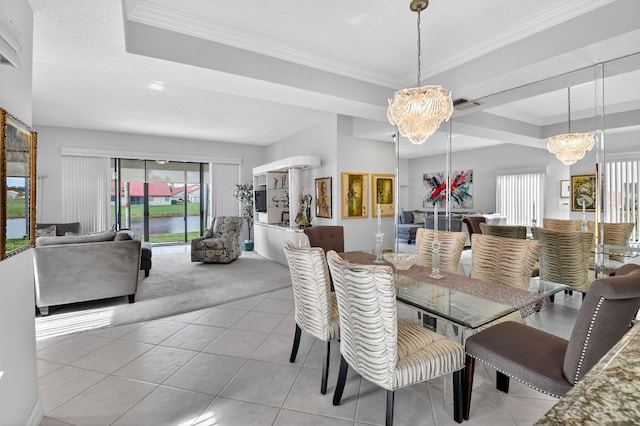 7824 Lexington Club Blvd Unit A, Delray Beach, FL 33446 - carpeted dining area with a chandelier, a raised ceiling, crown molding, and tile patterned floors