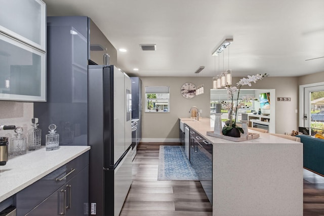 1170 S Drive Cir Unit B, Delray Beach, FL 33445 - kitchen with freestanding refrigerator, dark wood-style floors, pendant lighting, recessed lighting, and modern cabinets