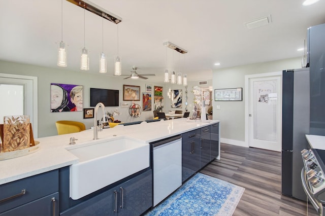 1170 S Drive Cir Unit B, Delray Beach, FL 33445 - kitchen featuring blue cabinets, white dishwasher, stove, light countertops, and decorative light fixtures