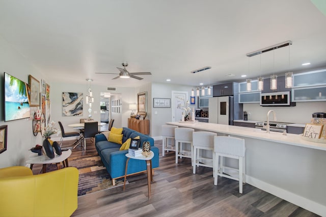 1170 S Drive Cir Unit B, Delray Beach, FL 33445 - living area featuring dark wood-type flooring, ceiling fan, and recessed lighting