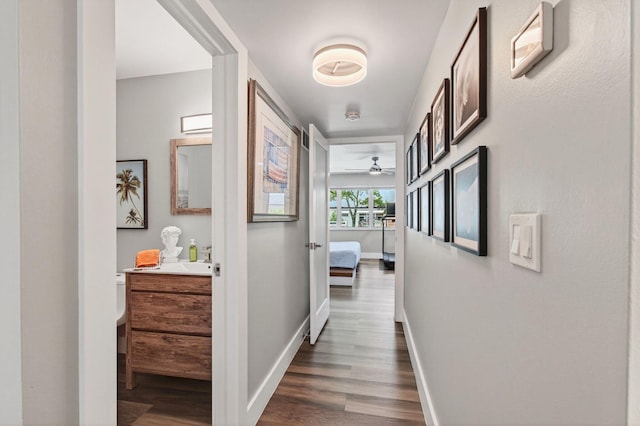 1170 S Drive Cir Unit B, Delray Beach, FL 33445 - hallway with dark wood-style flooring and baseboards