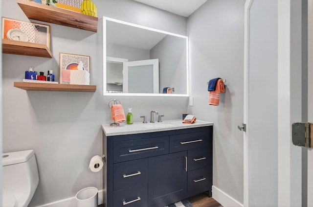1170 S Drive Cir Unit B, Delray Beach, FL 33445 - bathroom featuring vanity and wood finished floors