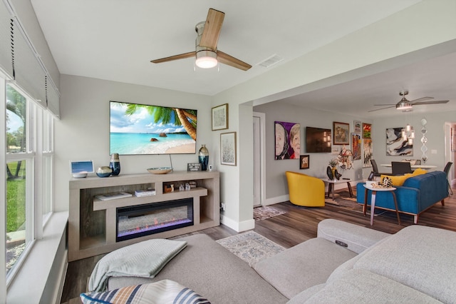 1170 S Drive Cir Unit B, Delray Beach, FL 33445 - living area with ceiling fan, wood finished floors, and a glass covered fireplace