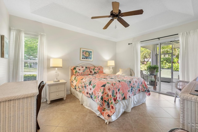 1200 SW Arrowhead Ct, Palm City, FL 34990 - bedroom with a raised ceiling, multiple windows, and access to outside