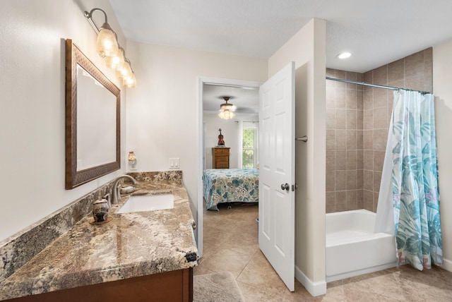 1200 SW Arrowhead Ct, Palm City, FL 34990 - ensuite bathroom featuring vanity, shower / bath combo, tile patterned flooring, and ceiling fan
