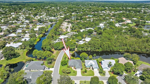 1200 SW Arrowhead Ct, Palm City, FL 34990 - aerial overview of property's location featuring a large body of water and nearby suburban area