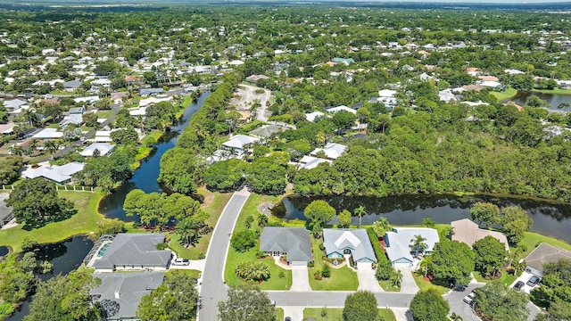 1200 SW Arrowhead Ct, Palm City, FL 34990 - aerial overview of property's location with a large body of water and nearby suburban area