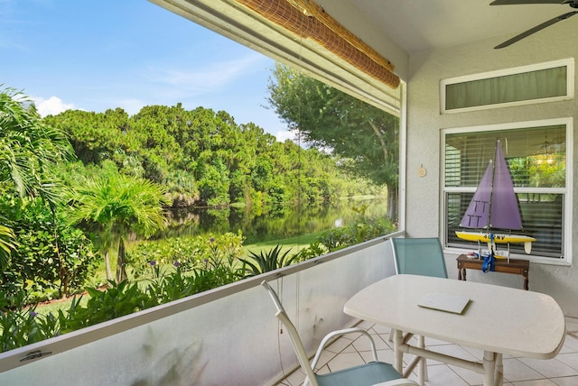1200 SW Arrowhead Ct, Palm City, FL 34990 - balcony featuring ceiling fan, a water view, and outdoor dining space