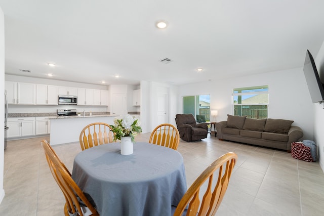 1312 SW Calmar Ave Unit 164, Port Saint Lucie, FL 34953 - dining area featuring light tile patterned floors and recessed lighting