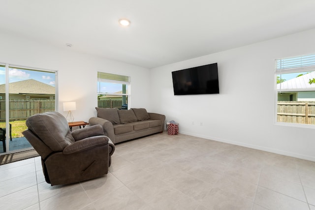 1312 SW Calmar Ave Unit 164, Port Saint Lucie, FL 34953 - living area with plenty of natural light and light tile patterned flooring