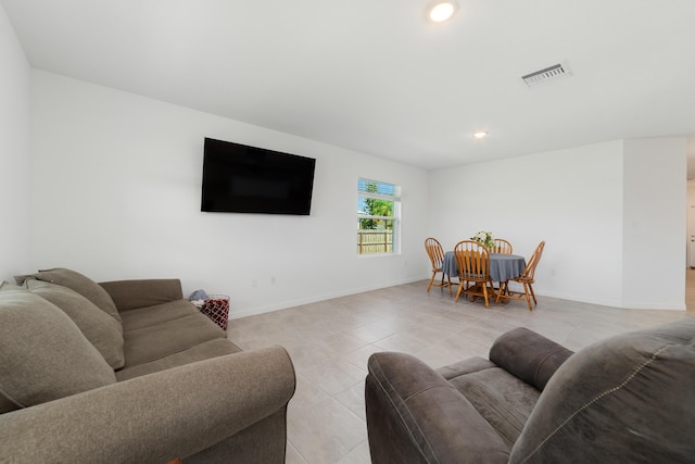 1312 SW Calmar Ave Unit 164, Port Saint Lucie, FL 34953 - living room with light tile patterned flooring and recessed lighting