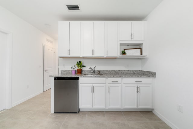 1312 SW Calmar Ave Unit 164, Port Saint Lucie, FL 34953 - kitchen with dishwashing machine, white cabinets, light stone countertops, and open shelves