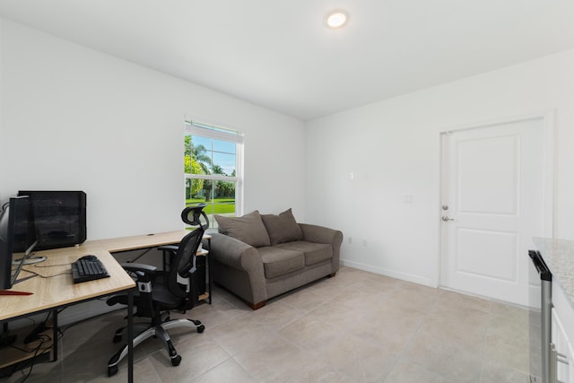 1312 SW Calmar Ave Unit 164, Port Saint Lucie, FL 34953 - home office featuring light tile patterned flooring and baseboards