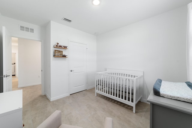 1312 SW Calmar Ave Unit 164, Port Saint Lucie, FL 34953 - bedroom with baseboards and a nursery area