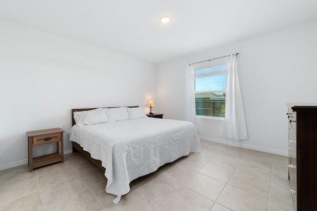 1312 SW Calmar Ave Unit 164, Port Saint Lucie, FL 34953 - bedroom with light tile patterned floors and baseboards