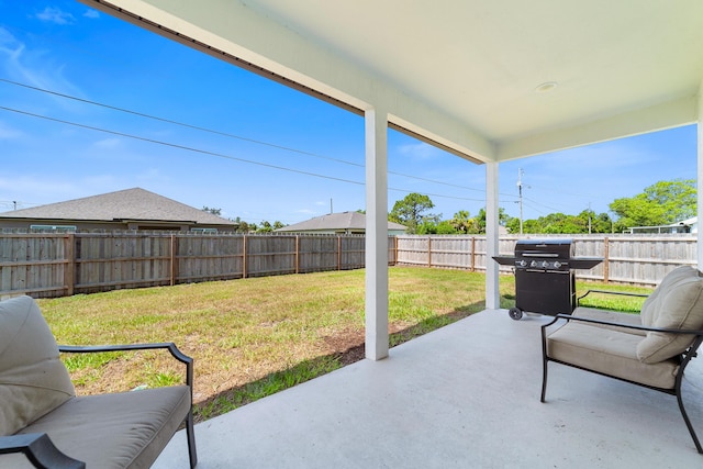 1312 SW Calmar Ave Unit 164, Port Saint Lucie, FL 34953 - fenced backyard featuring area for grilling and a patio
