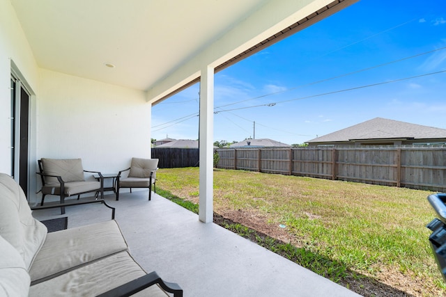 1312 SW Calmar Ave Unit 164, Port Saint Lucie, FL 34953 - fenced backyard with a patio area and outdoor lounge area