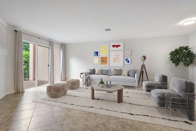 8183 Emerald Winds Cir, Boynton Beach, FL 33473 - tiled living room featuring baseboards