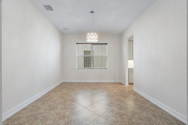 8183 Emerald Winds Cir, Boynton Beach, FL 33473 - empty room with a chandelier and light tile patterned floors