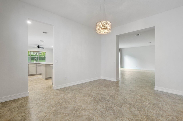 8183 Emerald Winds Cir, Boynton Beach, FL 33473 - spare room with a chandelier and baseboards
