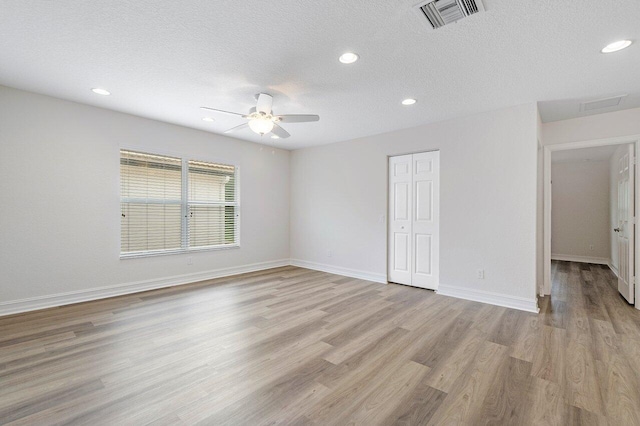 8183 Emerald Winds Cir, Boynton Beach, FL 33473 - empty room featuring light wood finished floors, ceiling fan, a textured ceiling, and recessed lighting