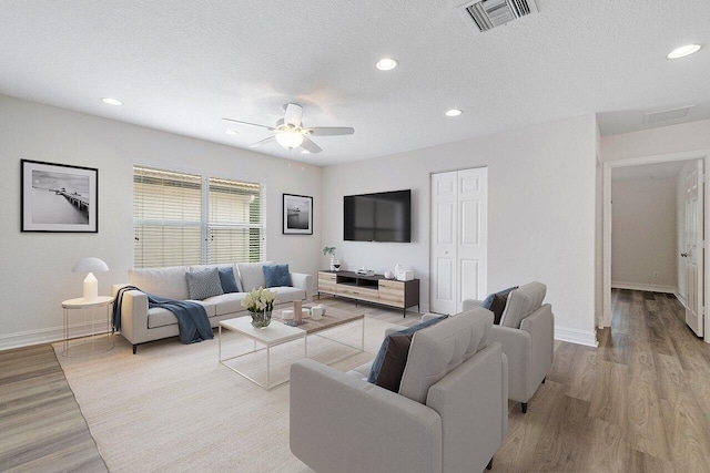 8183 Emerald Winds Cir, Boynton Beach, FL 33473 - living area featuring wood finished floors, a ceiling fan, recessed lighting, and a textured ceiling