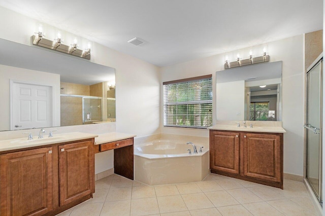 8183 Emerald Winds Cir, Boynton Beach, FL 33473 - bathroom featuring a stall shower, two vanities, a bath, and tile patterned flooring