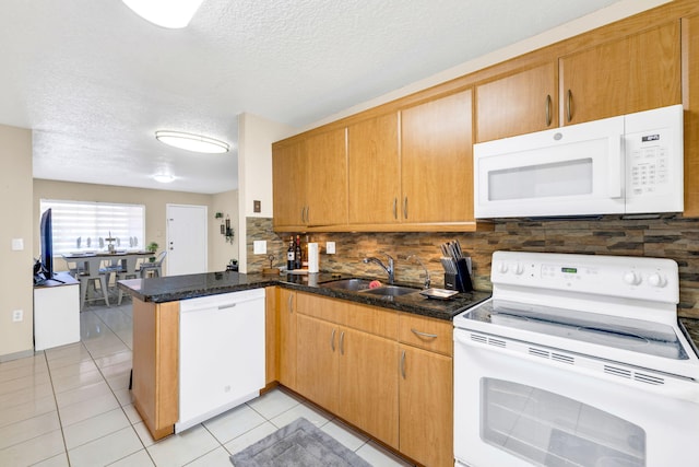 7853 W 36th Ave Unit 104, Hialeah, FL 33018 - kitchen featuring white appliances, a peninsula, decorative backsplash, a textured ceiling, and light tile patterned floors