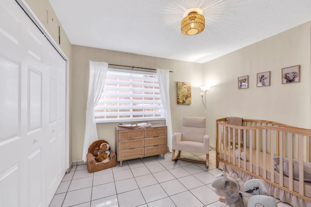 7853 W 36th Ave Unit 104, Hialeah, FL 33018 - bedroom with a closet, light tile patterned flooring, and a nursery area
