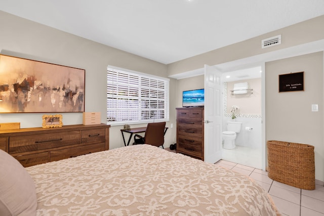 7853 W 36th Ave Unit 104, Hialeah, FL 33018 - bedroom with light tile patterned floors and connected bathroom