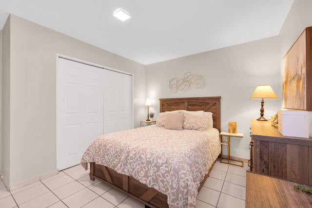 7853 W 36th Ave Unit 104, Hialeah, FL 33018 - bedroom with light tile patterned floors and a closet