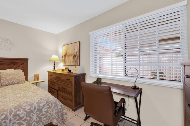 7853 W 36th Ave Unit 104, Hialeah, FL 33018 - bedroom with light tile patterned floors and a desk