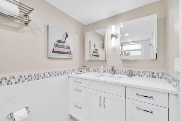 7853 W 36th Ave Unit 104, Hialeah, FL 33018 - bathroom featuring vanity, recessed lighting, and tile walls