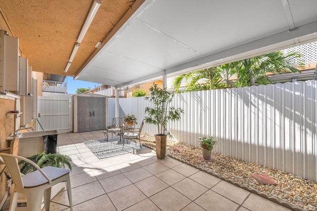 7853 W 36th Ave Unit 104, Hialeah, FL 33018 - fenced backyard with a patio