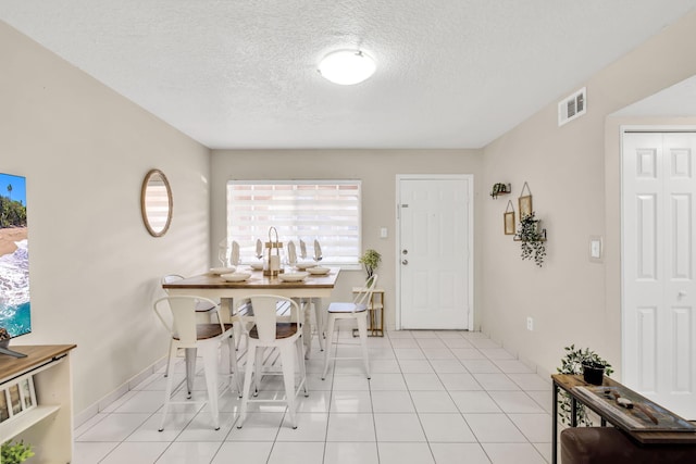 7853 W 36th Ave Unit 104, Hialeah, FL 33018 - dining room with a textured ceiling