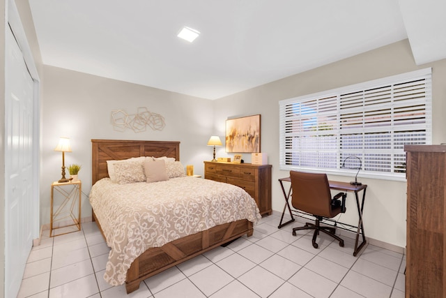7853 W 36th Ave Unit 104, Hialeah, FL 33018 - bedroom with light tile patterned floors and a closet