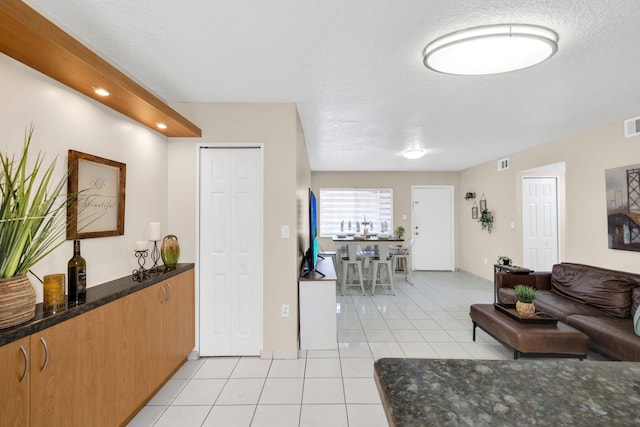 7853 W 36th Ave Unit 104, Hialeah, FL 33018 - living area featuring light tile patterned floors, a textured ceiling, and recessed lighting