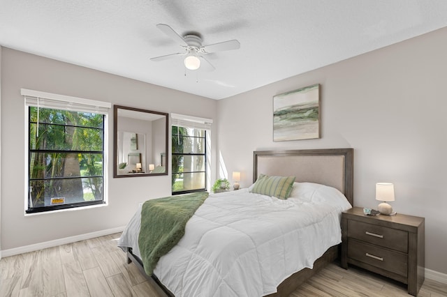 193 SE 1st Cir Unit 6B, Boynton Beach, FL 33435 - bedroom featuring multiple windows, ceiling fan, and light wood-style floors