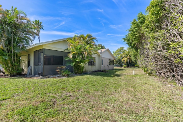 193 SE 1st Cir Unit 6B, Boynton Beach, FL 33435 - view of side of property featuring a yard and a sunroom