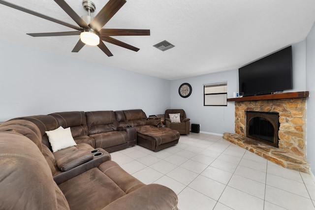 16888 W Stallion Dr, Loxahatchee, FL 33470 - living area featuring light tile patterned floors, a ceiling fan, and a fireplace