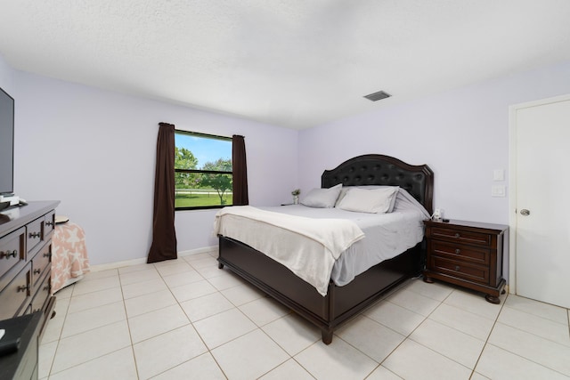 16888 W Stallion Dr, Loxahatchee, FL 33470 - bedroom with light tile patterned floors