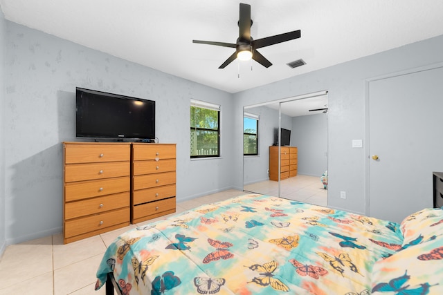 16888 W Stallion Dr, Loxahatchee, FL 33470 - bedroom featuring light tile patterned floors, a closet, and a ceiling fan