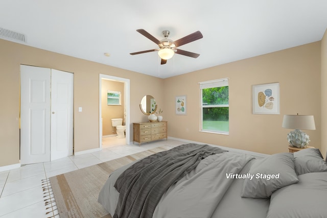 16888 W Stallion Dr, Loxahatchee, FL 33470 - bedroom featuring light tile patterned floors, ensuite bath, and ceiling fan