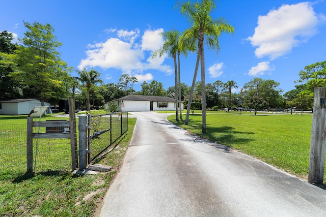 16888 W Stallion Dr, Loxahatchee, FL 33470 - view of front facade with asphalt driveway